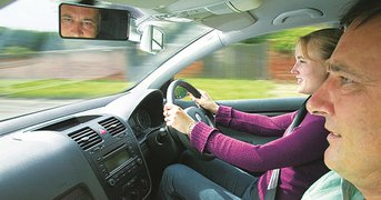 Learner driving with instructor as passenger.