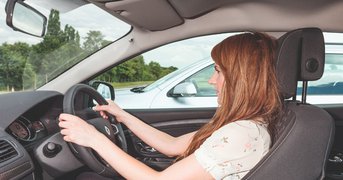 Female driver parking.